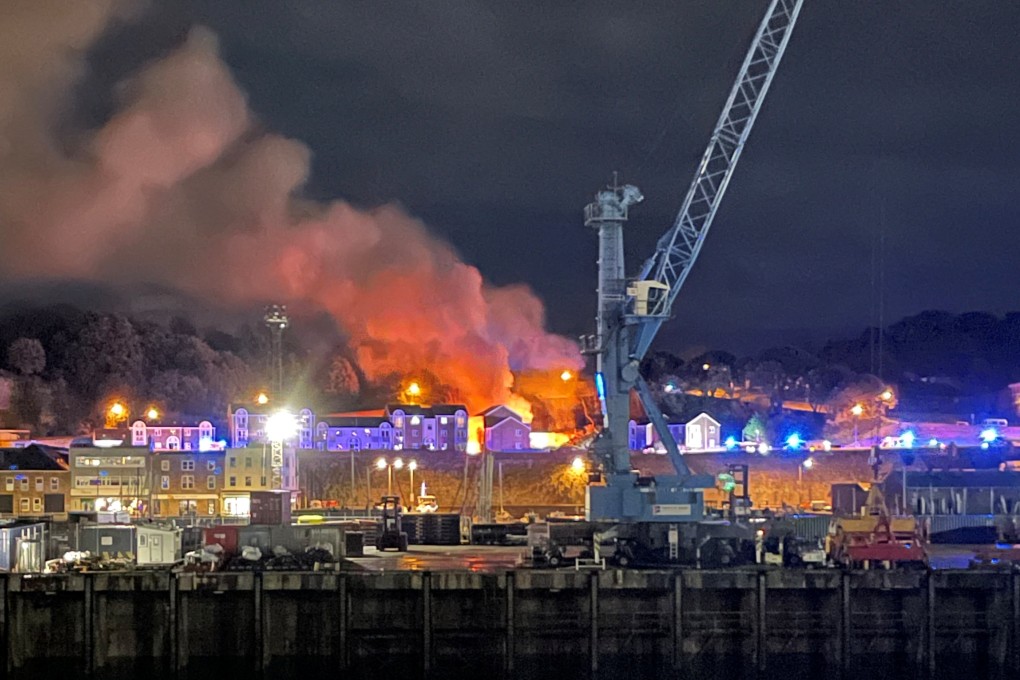 Fire and smoke in Saint Helier following an explosion on the island of Jersey, Channel Islands on Saturday. Photo: Daniel Hunt via Reuters