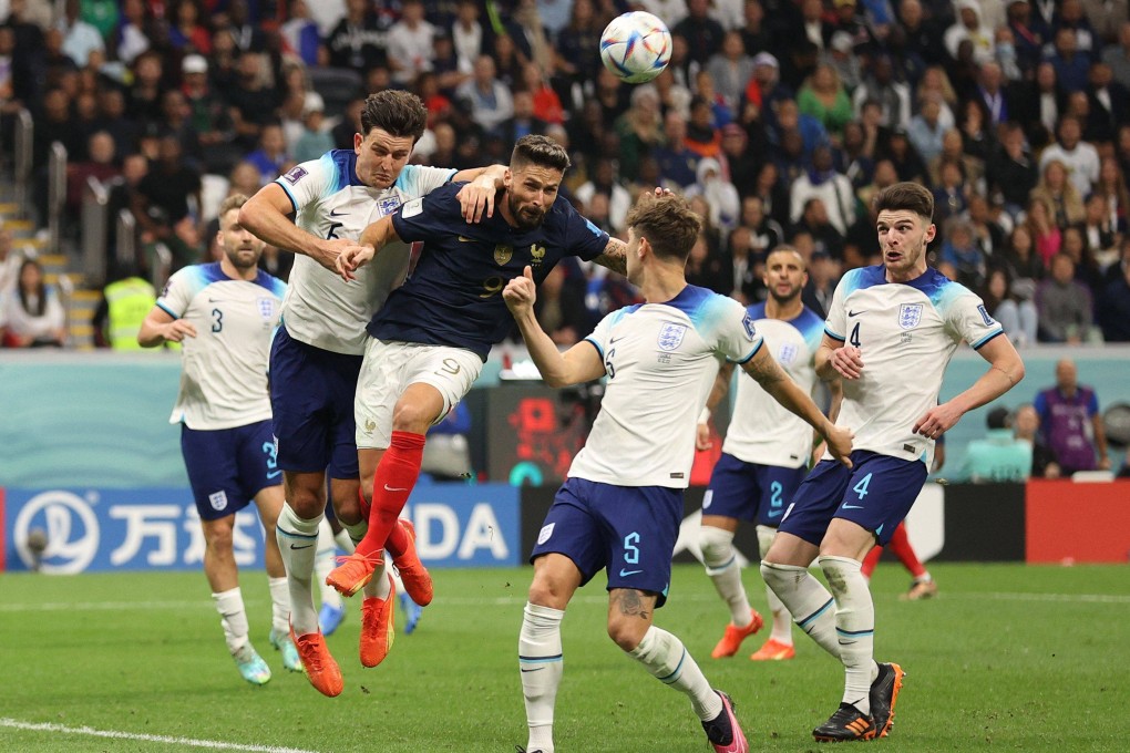 Olivier Giroud scores his team’s second goal past England’s defender during the World Cup quarter-final football match. Photo: AFP