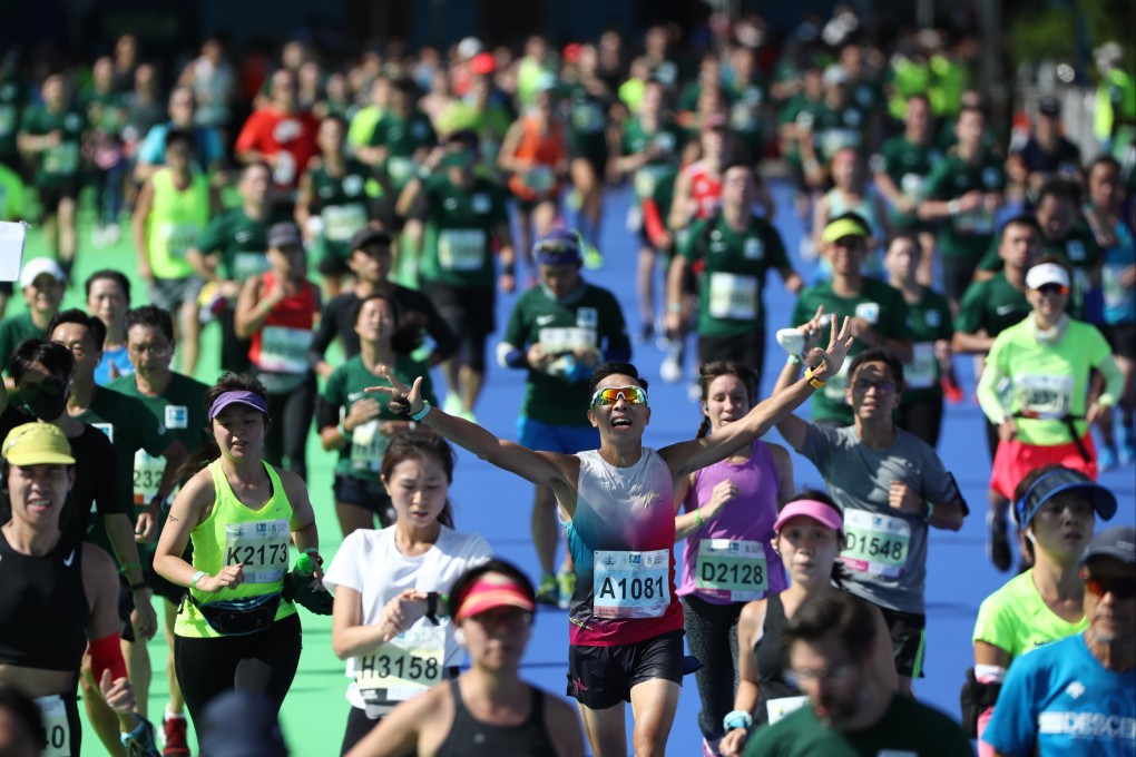 Runners arrive at Standard Chartered Hong Kong Marathon 2021 finish line at Victoria Park. Photo: Nora Tam