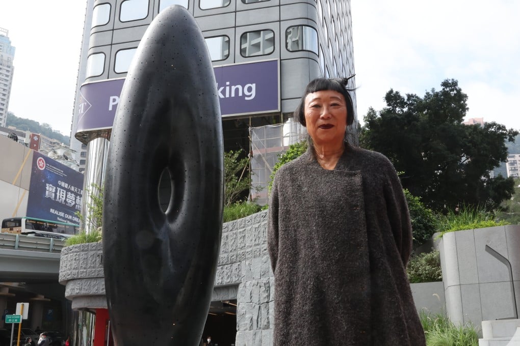 Artist Lindy Lee and her artwork “Eye of Infinity” at the Peak Tram’s Central terminus in Hong Kong. Photo: Edmond So
