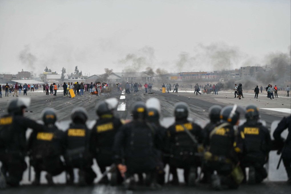 Demonstrators invade the runway of the international airport in Arequipa, which is a gateway to some of Peru’s tourist attractions. Photo: AFP