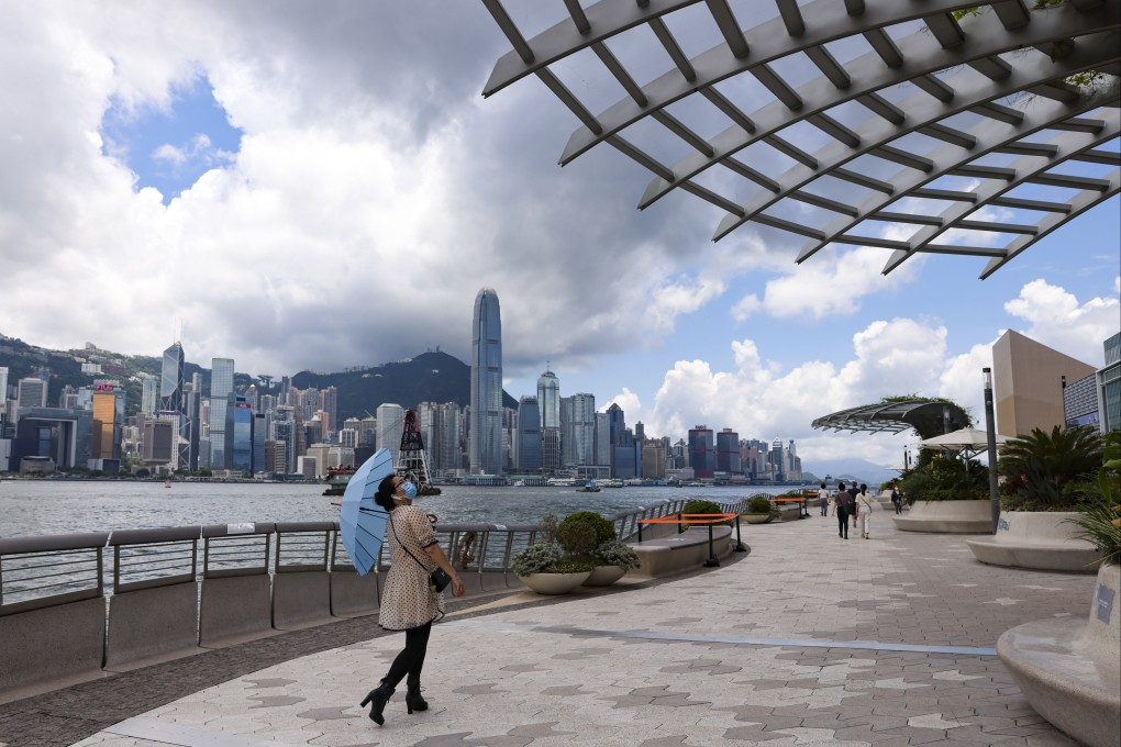 A woman walks down a deserted Avenue of Stars on the Tsim Sha Tsui promenade, which usually attracts crowds of tourists, in May 2021. Photo: Nora Tam