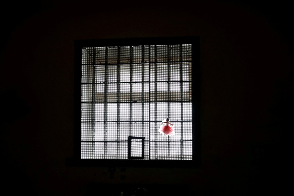 A doll is attached to the window of a cell at a preliminary detention centre in Kherson, which Ukrainians say was used by Russian service members to jail and torture people. Photo: Reuters