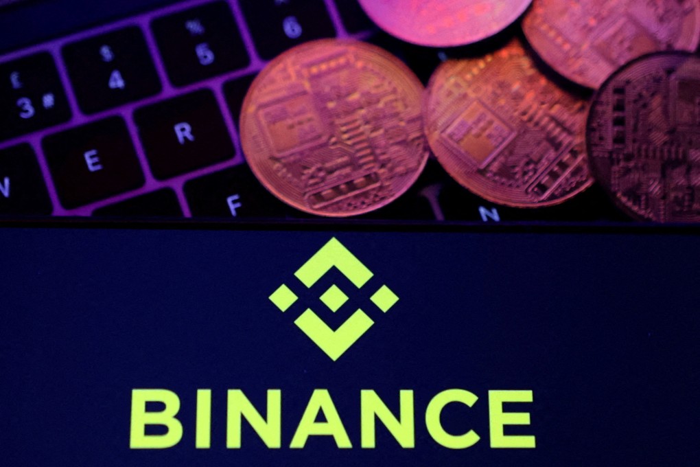 The Binance logo displayed on a smartphone with representations of cryptocurrencies placed on a keyboard in this illustration taken November 8, 2022. Photo: Reuters