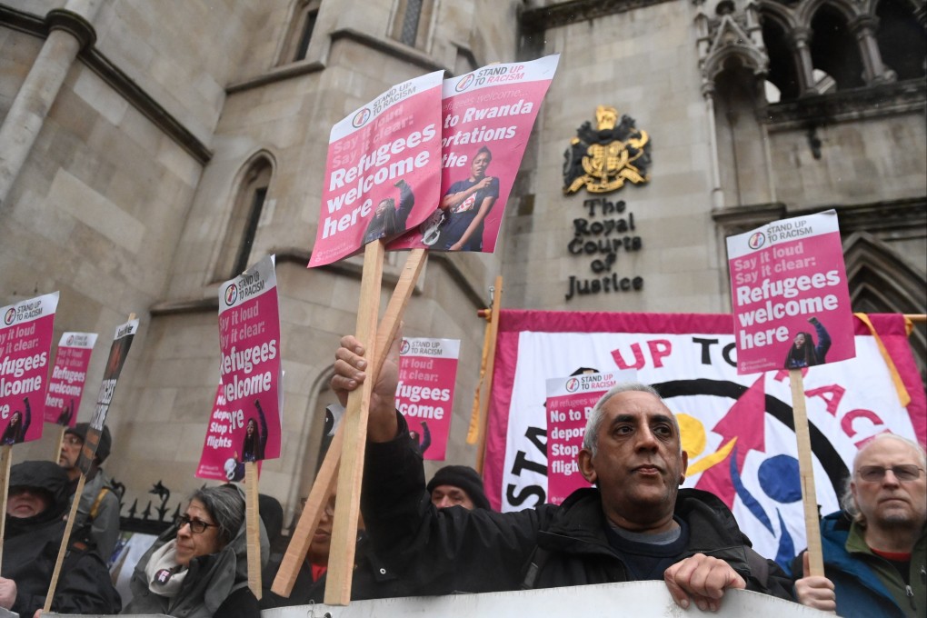 Members of the Stand up to Racism protest group demonstrate against the deportations of Refugees to Rwanda at the High Court in London on December 19. Photo:  EPA-EFE