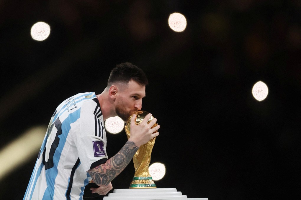 Argentina’s Lionel Messi kisses the World Cup trophy during the trophy ceremony. Photo: Reuters