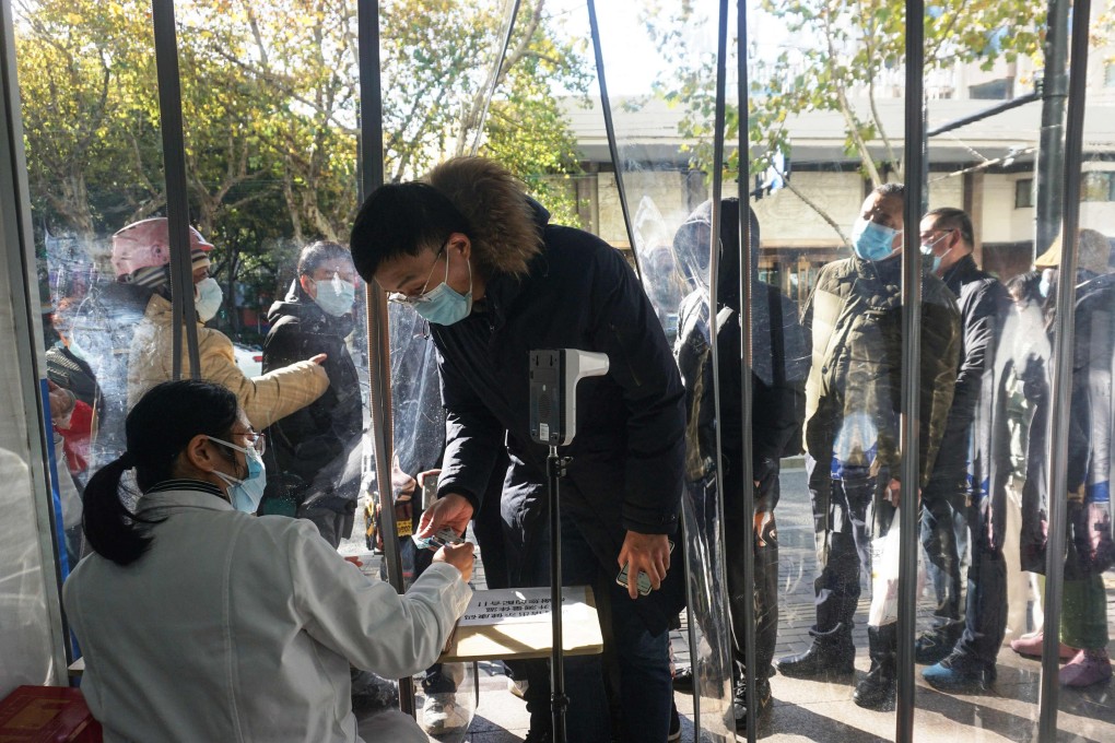 A man buys antigen test kits at a pharmacy amid the pandemic in Hangzhou, in China’s eastern Zhejiang province, on December 19. Photo: AFP