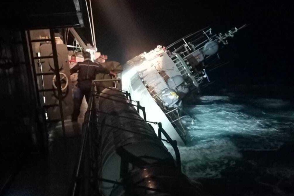 The HTMS Sukhothai leans on its side as its sinks off the coast of Thailand’s Prachuap Khiri Khan province late on Sunday night. Photo: Royal Thai Navy via AP