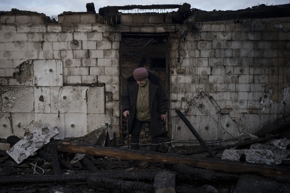 Olha Kobzarenko searches for her dog after a Russian drone attack in the village of Stari Bezradychi, Kyiv region, Ukraine. Photo: AP