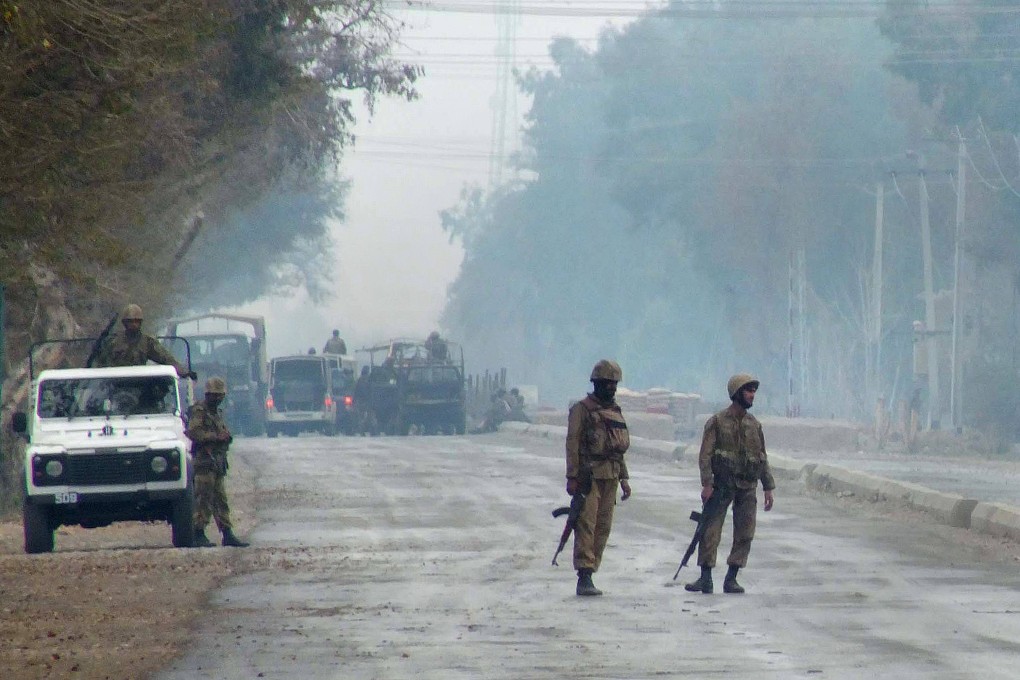 Pakistani troops patrol in Pakistan’s Lakki Marwat district in 2013. On Sunday, four Pakistani police officers were killed and another four critically wounded when suspected militants attacked a police station in the district. Photo: AFP