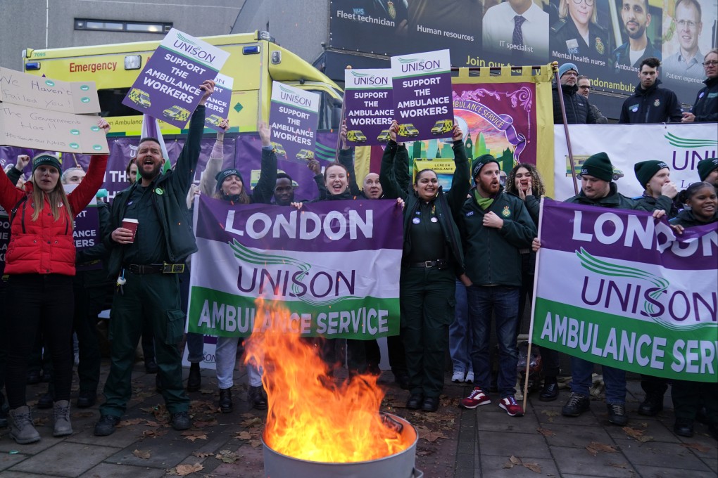 Ambulance workers on the picket line outside Waterloo ambulance station in London on Wednesday. Photo: PA Wire / dpa