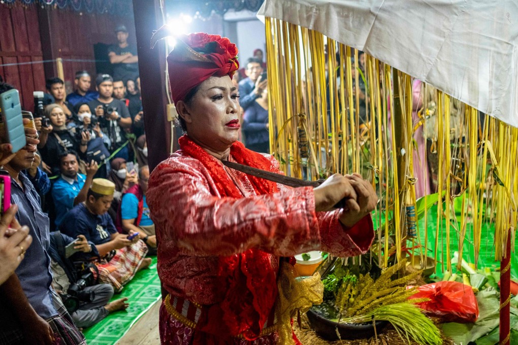A Bissu performs a dance during a Mappalili ceremony in Pangkajene. The ceremony marks the start of the planting season on the island of Sulawesi. Photo: AFP