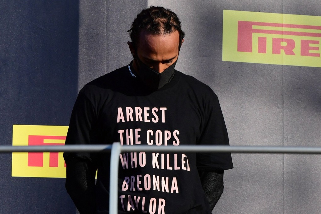 Lewis Hamilton wears a shirt in reference to Breonna Taylor on the podium after winning the Tuscan Grand Prix in 2020. Photo: Reuters