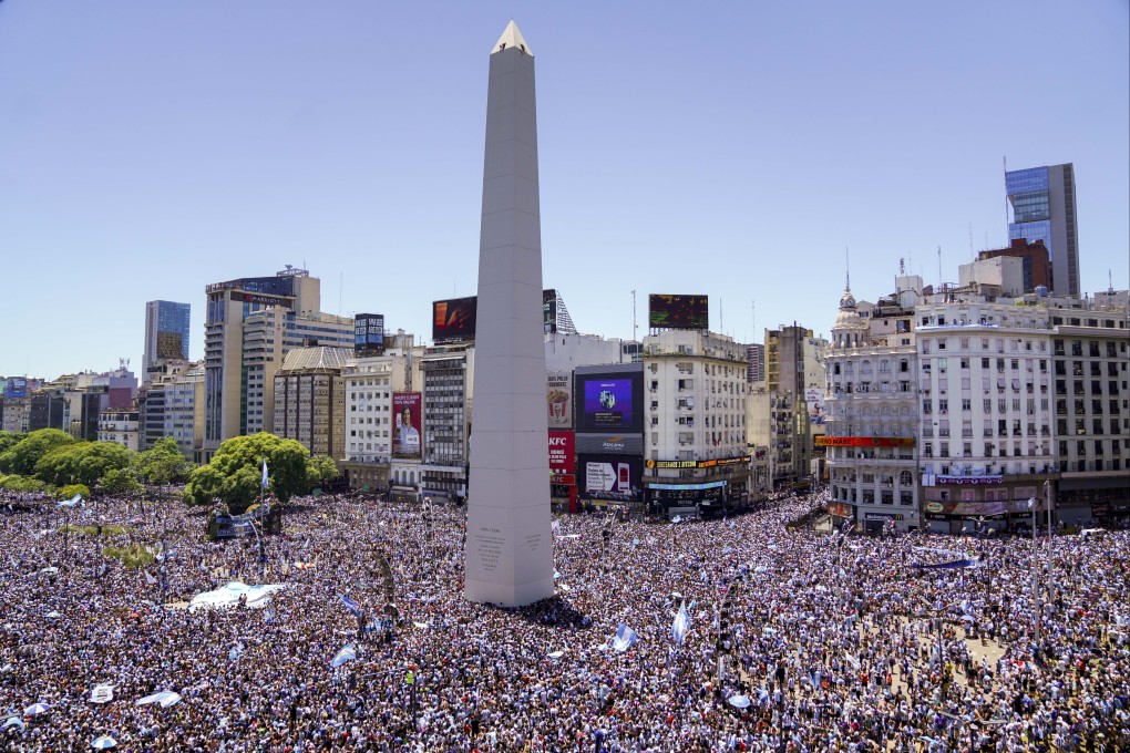 Argentine football fans descend on the Obelisk monument in Buenos Aires on Tuesday for a parade to welcome back the Argentine team that won the Fifa World Cup tournament which was held in Qatar. Photo: AP