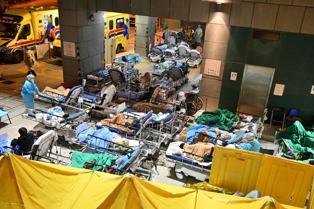 Patients lie in hospital beds as temperatures fall at nighttime outside the Caritas Medical Centre in Sham Shui Po on February 16. The fifth wave that started the year marked one of the lowest points of the pandemic for Hong Kong. Photo: AFP