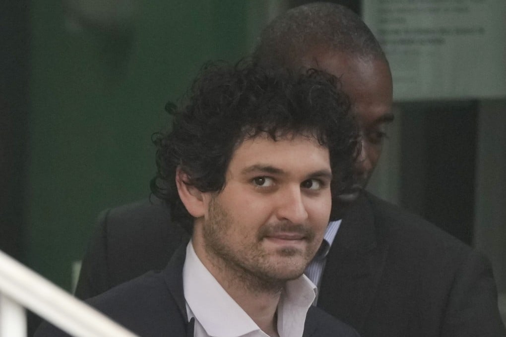 FTX founder Sam Bankman-Fried, being escorted from the Magistrate Court in Nassau, Bahamas. Photo: AP