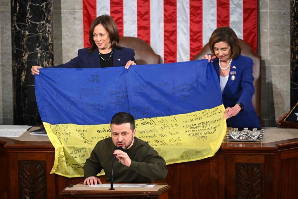 Ukraine’s President Volodymyr Zelensky speaks after giving a Ukrainian national flag to US House Speaker Nancy Pelosi and US Vice-President Kamala Harris during his address to the US Congress. Photo: AFP