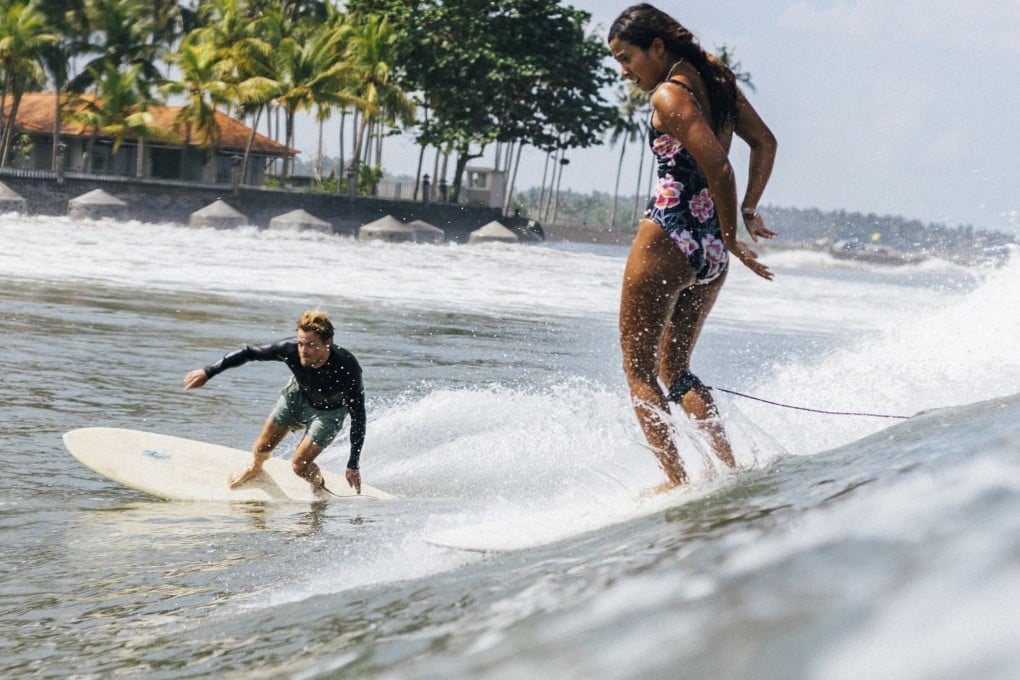 Dropping in, or stealing someone else’s wave, is among the worst breaches of surfing etiquette there is, and in the breaks off Medewi, Bali, it has become more common with the growth in foreign tourists surfing there. Here, a woman surfer drops in on another surfer riding a wave. Photo: Instagram/@onedayasurfer