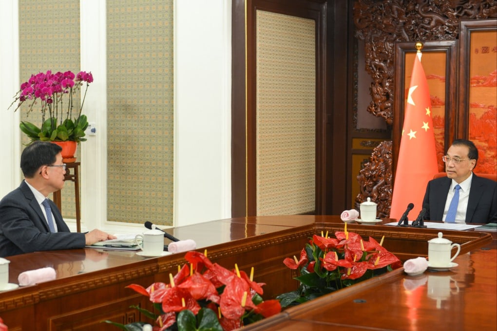 Premier Li Keqiang (right) meets John Lee in Beijing. Photo: Handout