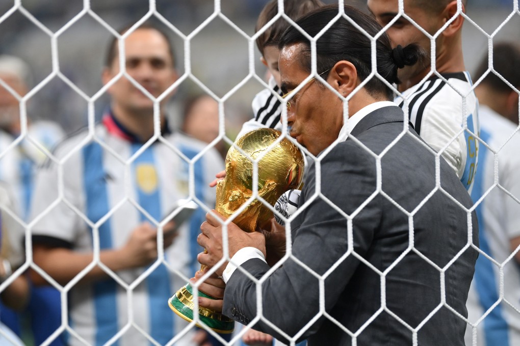 Nusret Goekce, nicknamed Salt Bae, kisses the Fifa World Cup trophy after the final between Argentina and France at Lusail Stadium. Photo: TNS