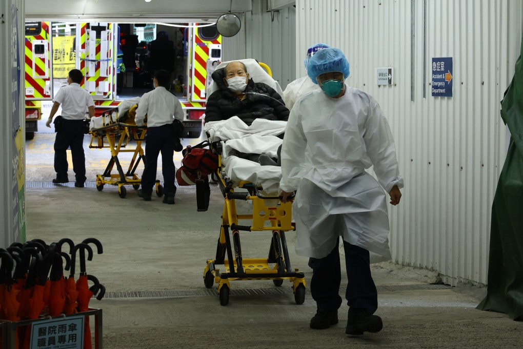 A elderly patient is transferred by ambulance staff members at United Christian Hospital in Kwun Tong on Thursday. Photo: Dickson Lee