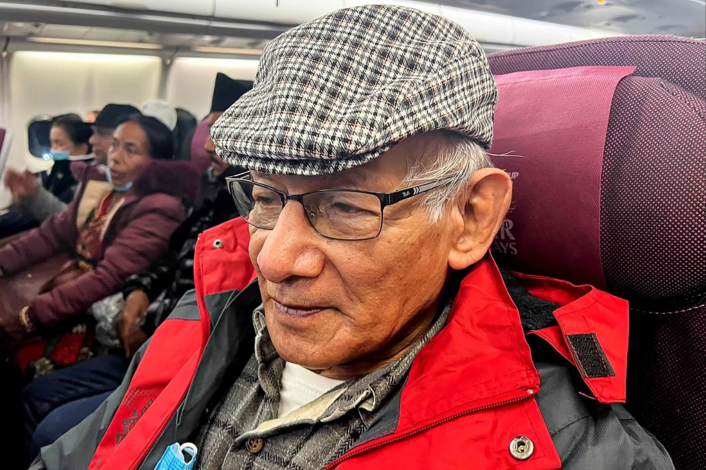 French serial killer Charles Sobhraj sits on a flight departing from Kathmandu to France. Photo: AFP