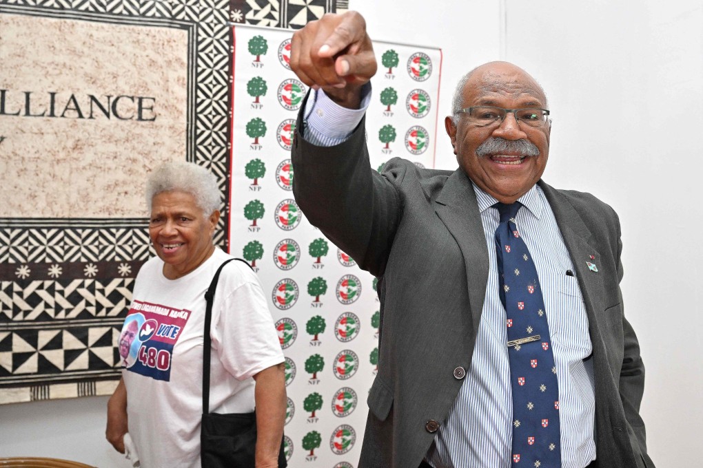 Fiji’s prime minister-elect Sitiveni Rabuka greets party workers in Suva on December 20. Photo: AFP