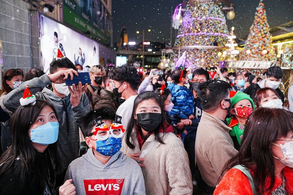 People at a Christmas lighting ceremony at a shopping mall in Hong Kong on December 24, 2022. Photo: Reuters