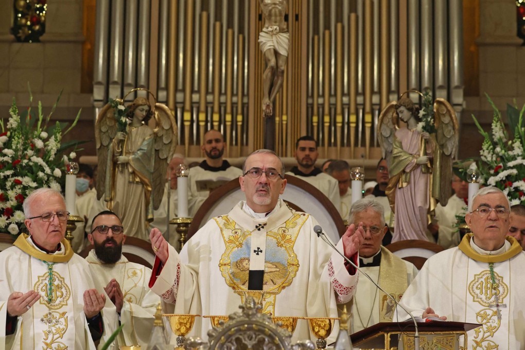 The acting Latin Patriarch of Jerusalem Pierbattista Pizzaballa leads a Christmas midnight mass at Saint Catherine’s Church, in the Church of the Nativity, in Bethlehem, in the Israeli-occupied West Bank on December 25. Photo: AFP
