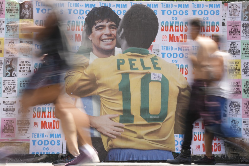 People walks past a mural of Brazilian soccer legend Pele. Photo: AP