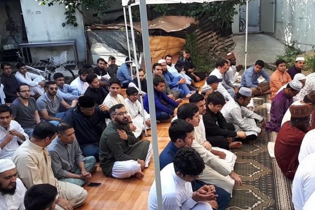 Muslim residents gather for prayer near the mosque’s construction site in Daehyeon-dong, Daegu. Photo: Handout