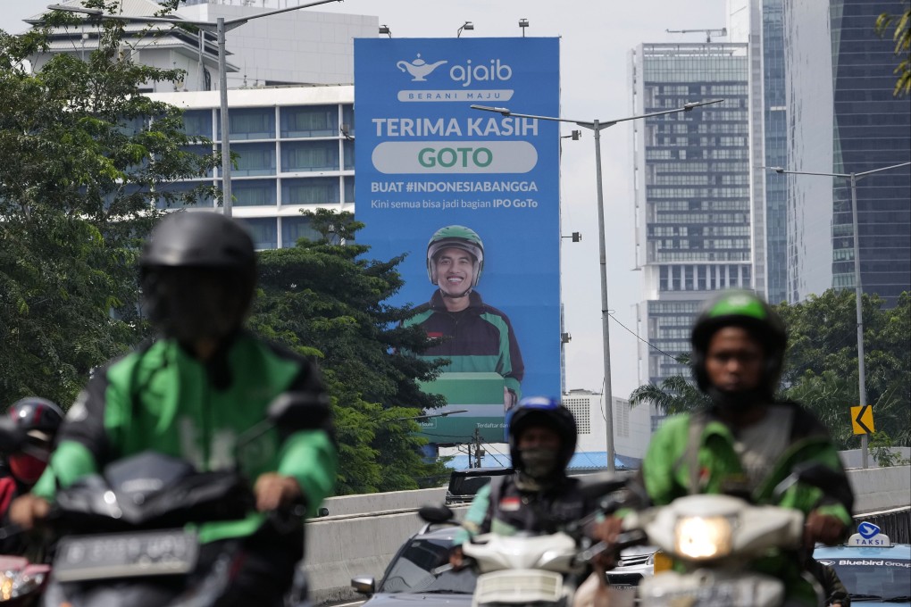 Motorcyclists pass a billboard advertising GoTo, a merging of Indonesian tech company Gojek and e-commerce pioneer Tokopedia, in Jakarta, Indonesia, on April 8. Photo: Bloomberg