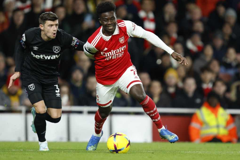 West Ham’s Aaron Cresswell (left) duels for the ball with Arsenal’s Bukayo Saka. Photo: AP