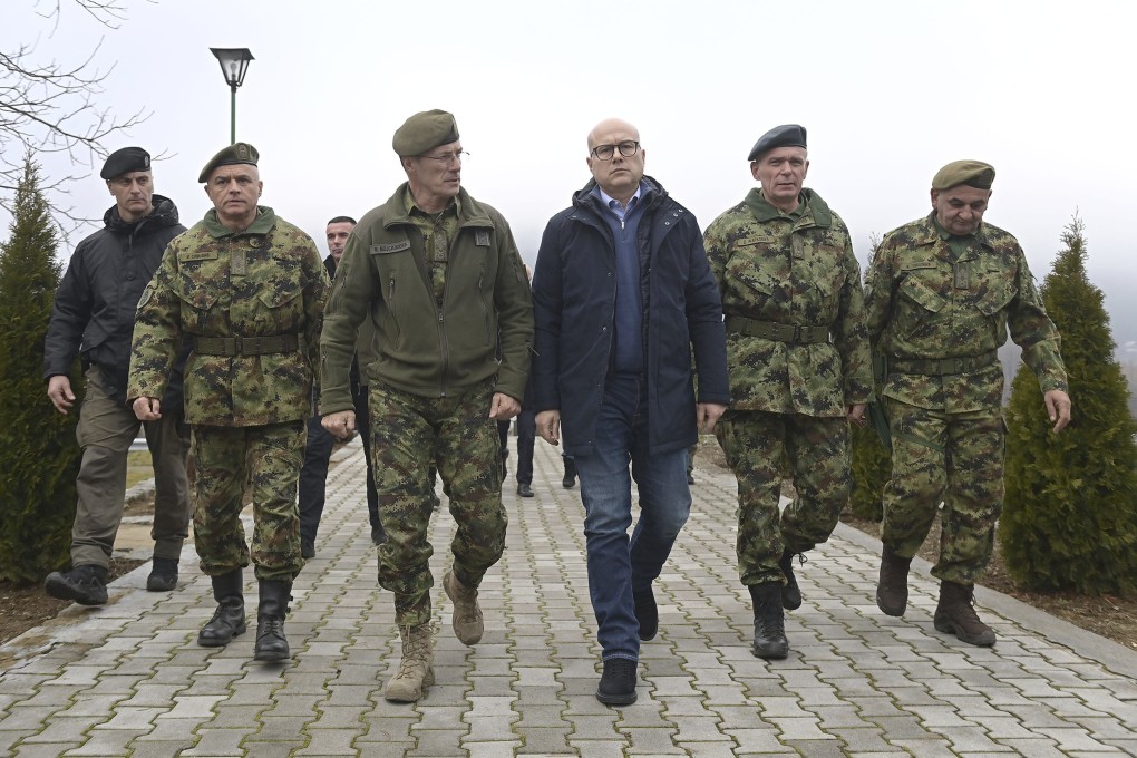 Serbia’s Defence Minister Milos Vucevic (in blue), with army brass on Monday. Photo: Serbian Presidential Press Service via AP