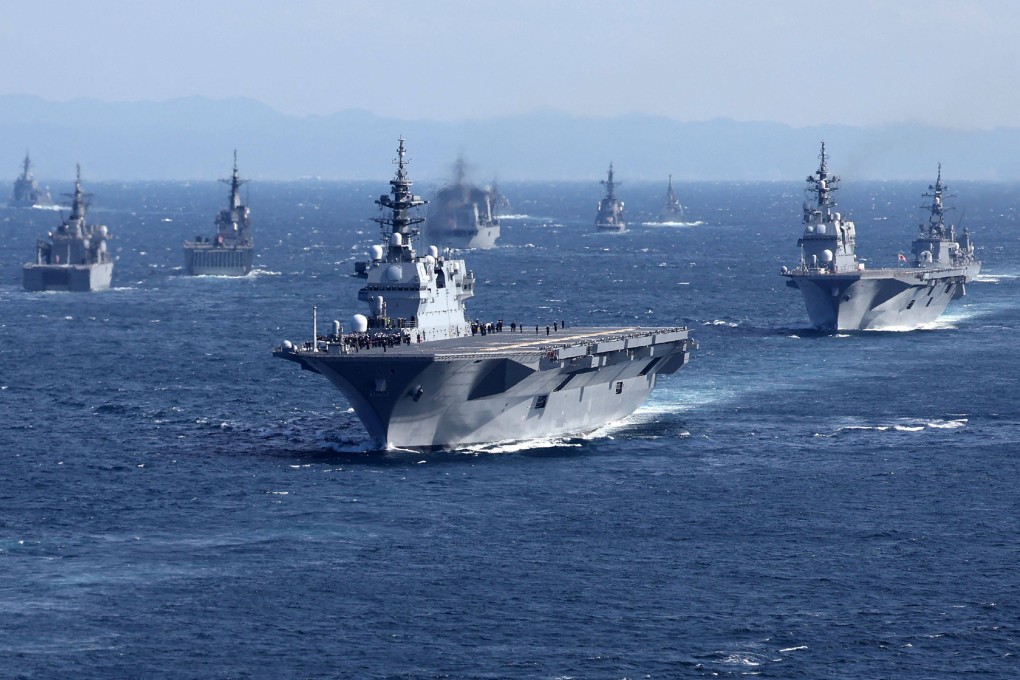 Military vessels including Japan’s Maritime Self-Defence Force’s largest carrier Izumo (centre) sailing in Sagami Bay during the International Fleet Review on November 6. Japan has announced on December 16 its biggest defence overhaul in decades, raising spending, reshaping its military command and acquiring new missiles to tackle the threat from China. Photo: AFP