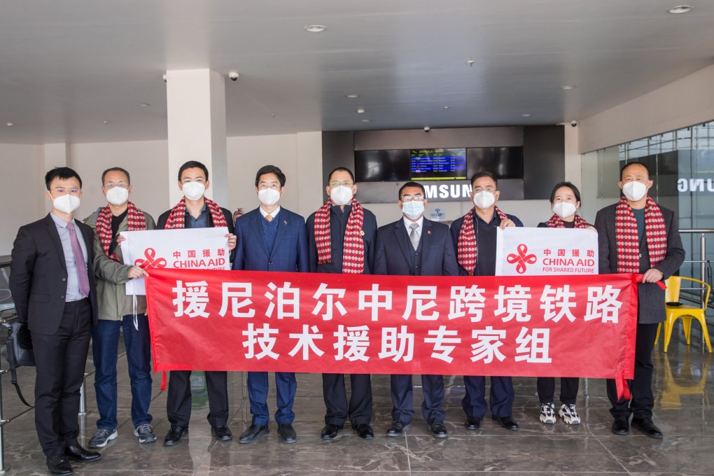 The team of experts poses alongside local Chinese officials in Kathmandu, Nepal.  Photo: Twitter