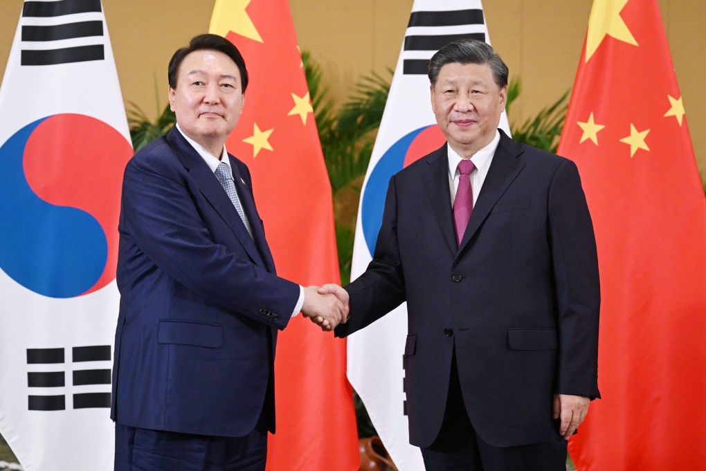 Chinese President Xi Jinping shakes hands with South Korean President Yoon Suk-yeol when they met on the sidelines of last month’s G20 summit in Indonesia. Photo: Xinhua