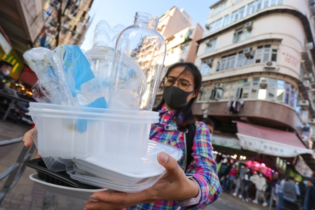 Sham Shui Po resident Yan Yuen carries waste to the nearest recycling station. Photo: May Tse
