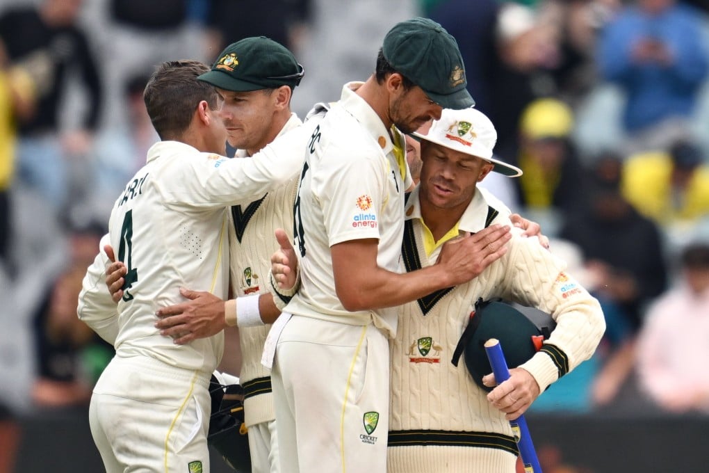 Mitchell Starc (centre) and David Warner of Australia celebrate their victory over South Africa at the MCG. Photo: EPA-EFE