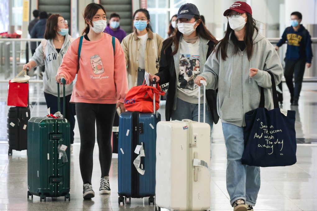 The first batch of arrivals after the city axed mandatory post-arrival tests expressed surprise and joy over the new measures. Photo: Jonathan Wong