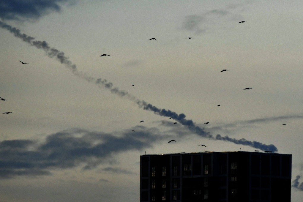 Missile contrails are seen in the sky over Kyiv on December 29 as a fresh barrage battered Ukraine. Photo: AFP