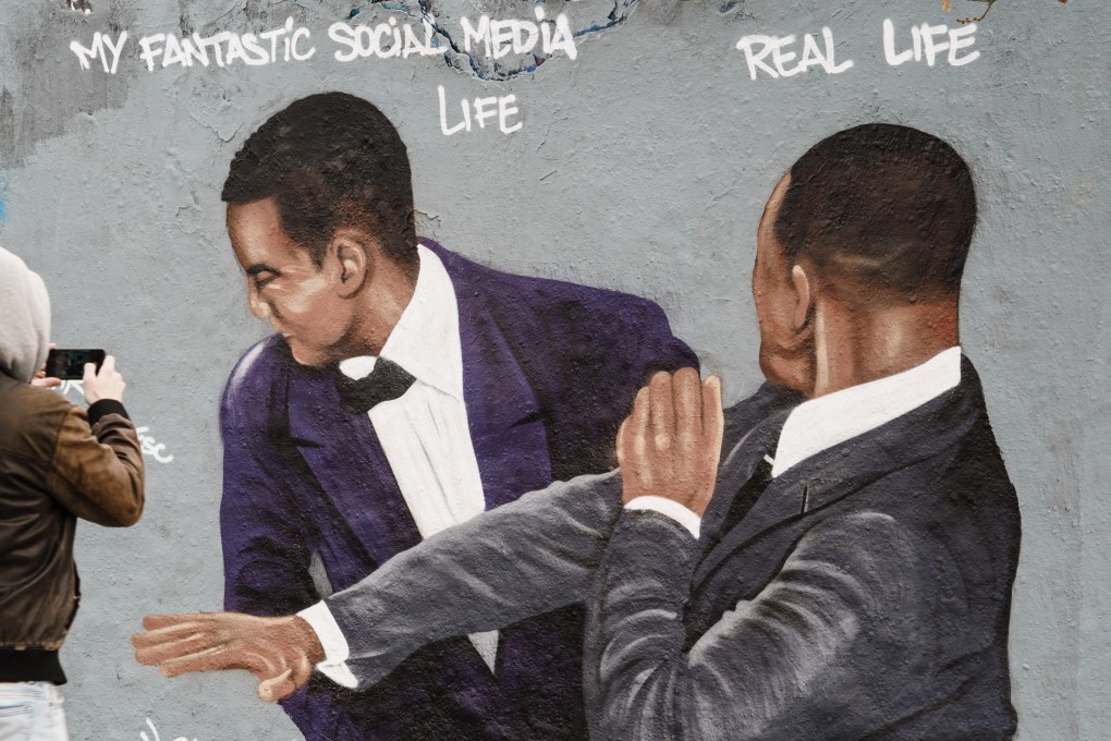 Remember THAT moment Will Smith smacked Chris Rock at the Oscars? Picutred is a graffiti mural showing the scene that took place at the Academy Awards. What other pop moments have you missed from 2022? Photo: EPA