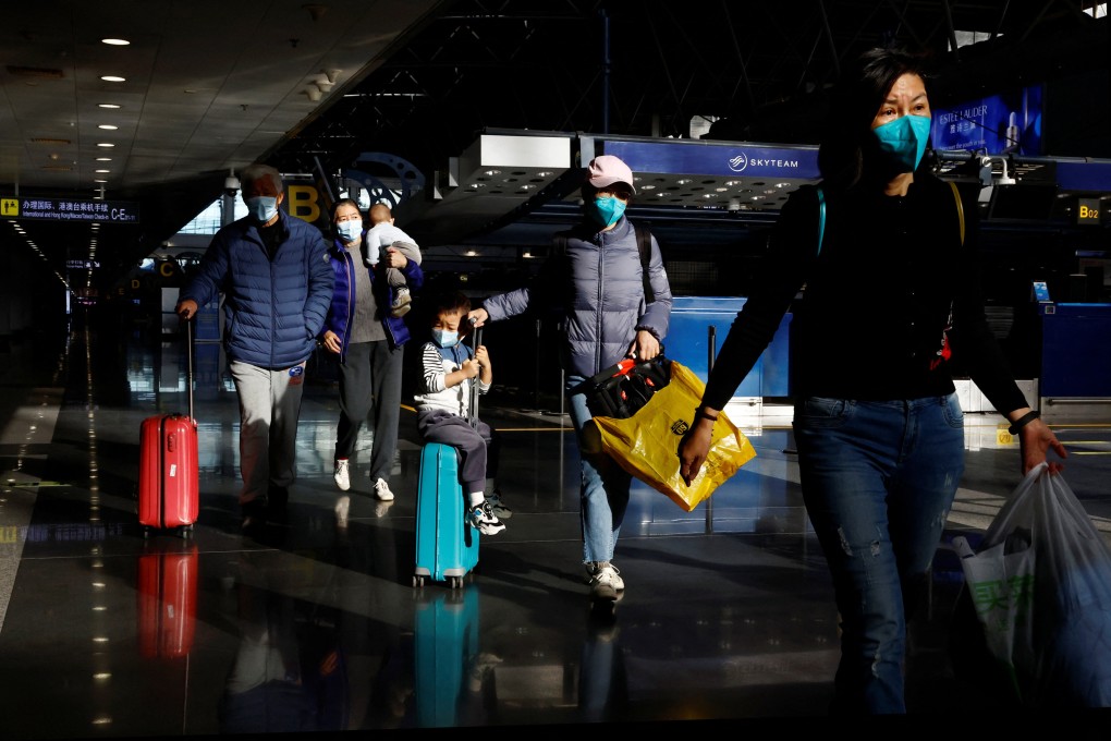 Travellers at Beijing Capital International Airport on Tuesday. Photo: Reuters