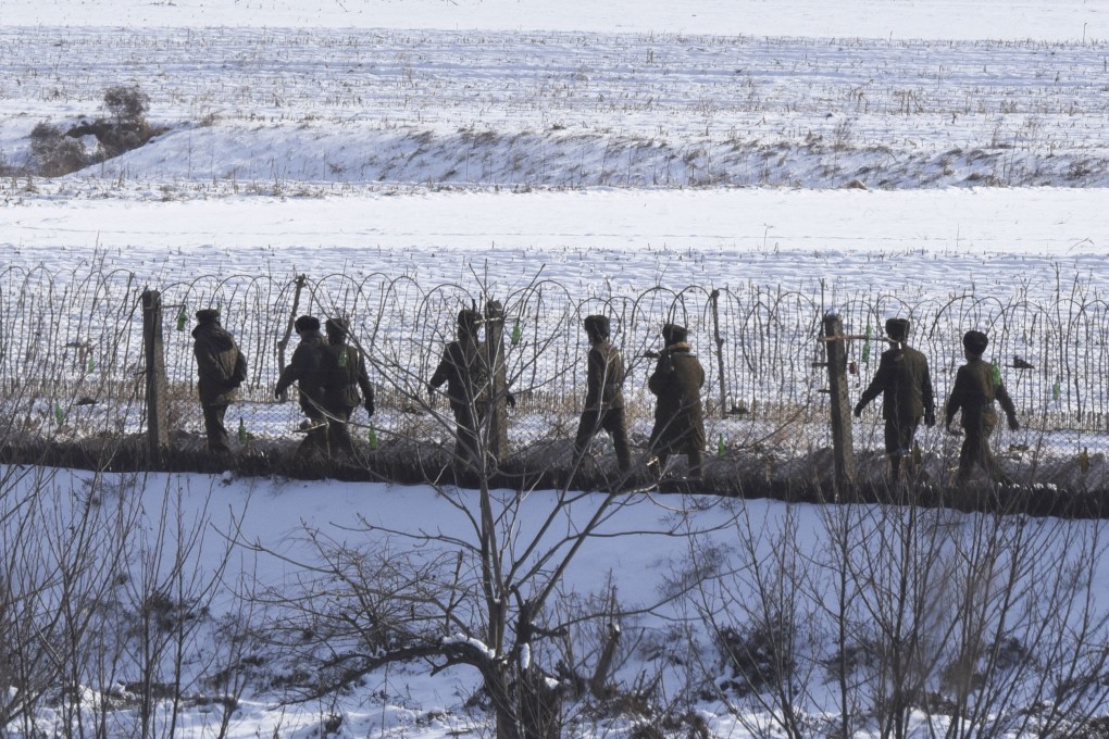 North Korean soldiers patrol on a riverside in the border county of Uiju, in a photo taken from China’s Dandong city. Photo: Kyodo