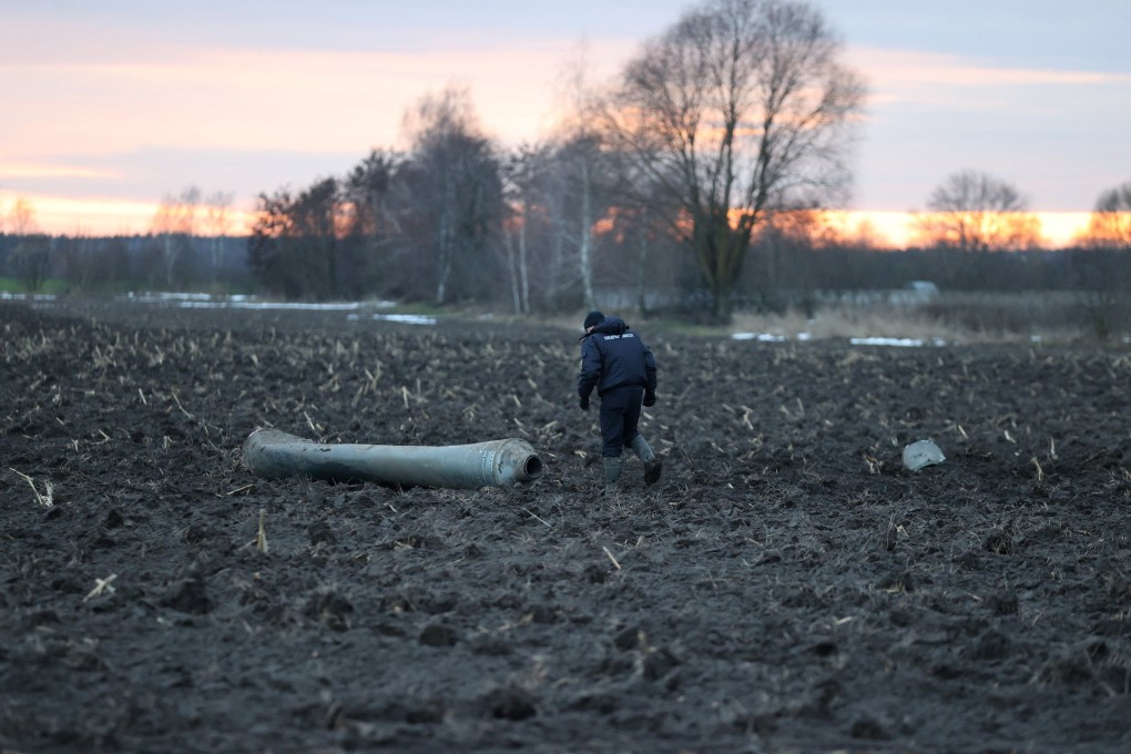 An investigator walks near what Belarus’ defence ministry said was part of a Ukrainian S-300 missile downed by Belarusian air defences near the village of Harbacha in the Grodno region of Belarus on Thursday. Photo:
Vadzim Yakubionak / BelTA / Handout via Reuters