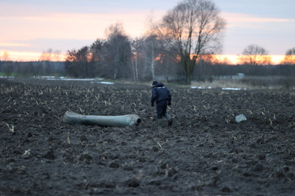 An investigator walks near what Belarus’ defence ministry said was part of a Ukrainian S-300 missile downed by Belarusian air defences near the village of Harbacha in the Grodno region of Belarus on Thursday. Photo:
Vadzim Yakubionak / BelTA / Handout via Reuters