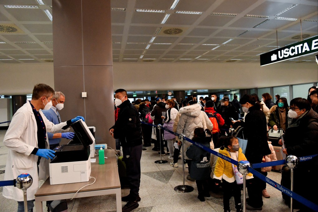 Passengers wait in a queue at Malpensa Airport in Milan, Italy on Thursday after Italy ordered Covid-19 tests for all travellers coming from China. Photo: Reuters