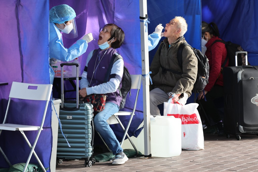 Travellers get Covid-19 PCR tests at the Shenzhen Bay Port in Hong Kong before heading to mainland China. Photo: Yik Yeung-man