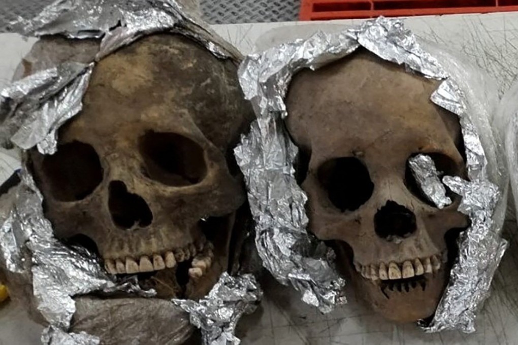 Four human skulls wrapped in plastic and aluminum foil were found by the National Guard inside a package bound for the United States at a courier company located at Mexico’s Queretaro Intercontinental airport. Photo: Mexican National Guard via Reuters