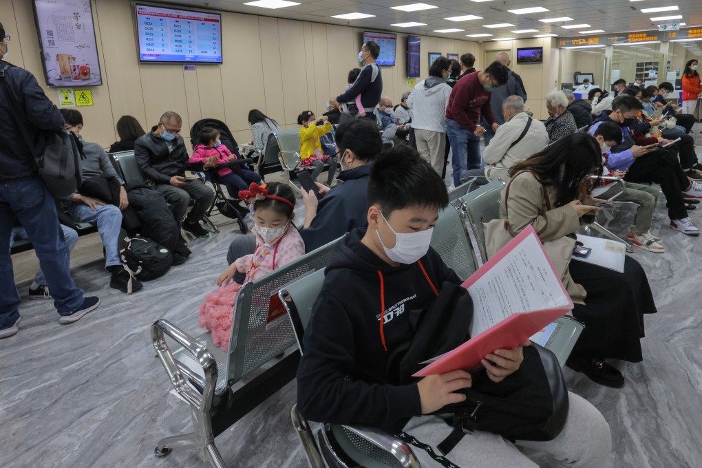 Crowds at a service centre for home permit applications in Hong Kong’s Sheung Wan. Photo: Jelly Tse